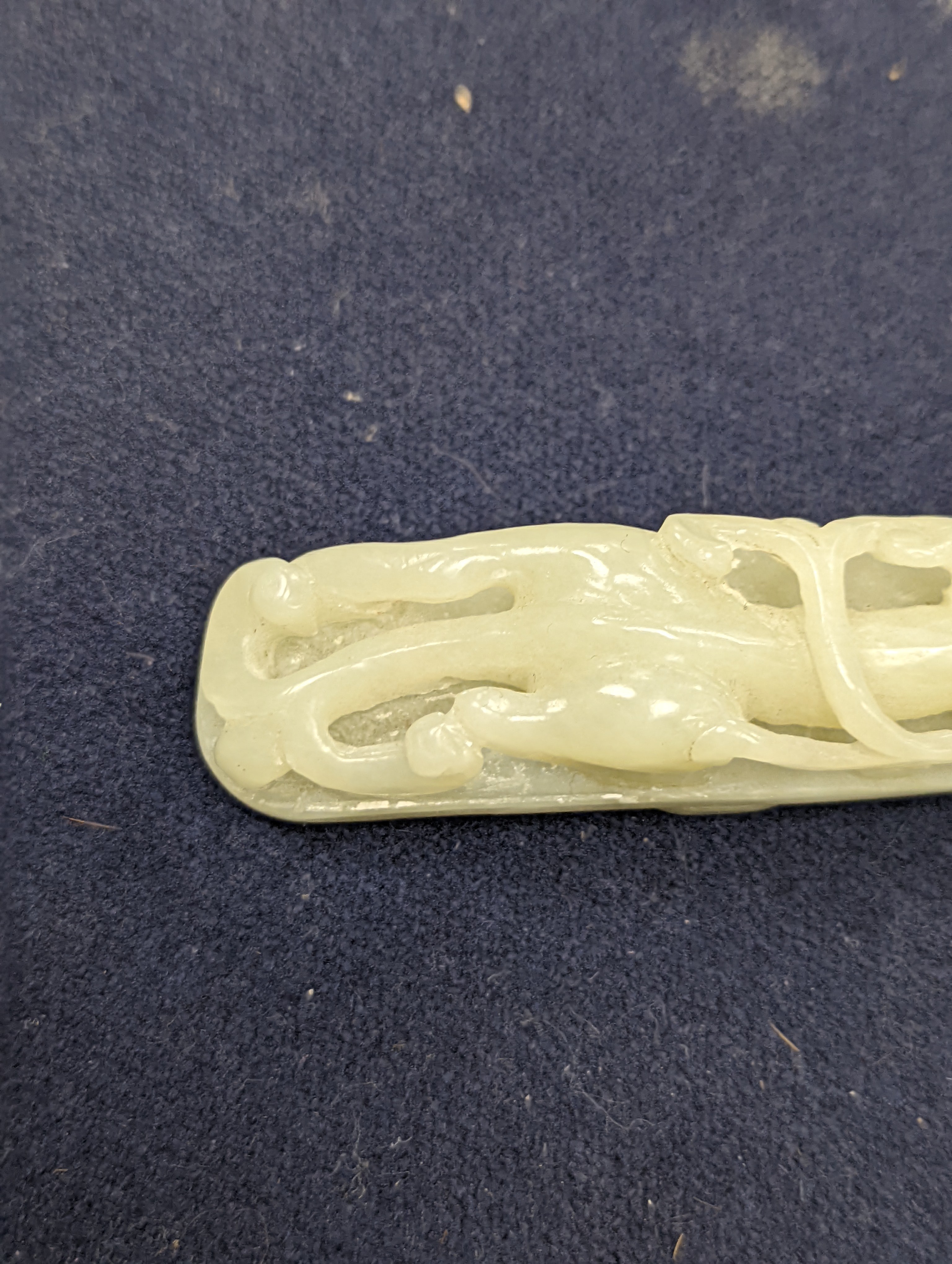 A Chinese jade belt hook, 12.5cm an archer's ring and figure, a stone cup and a glass snuff bottle